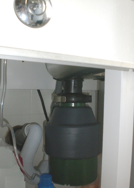 Image 2: A <i>garburator</i> installed under a sink. Source: Wikimedia Commons. Photo: Flammingo