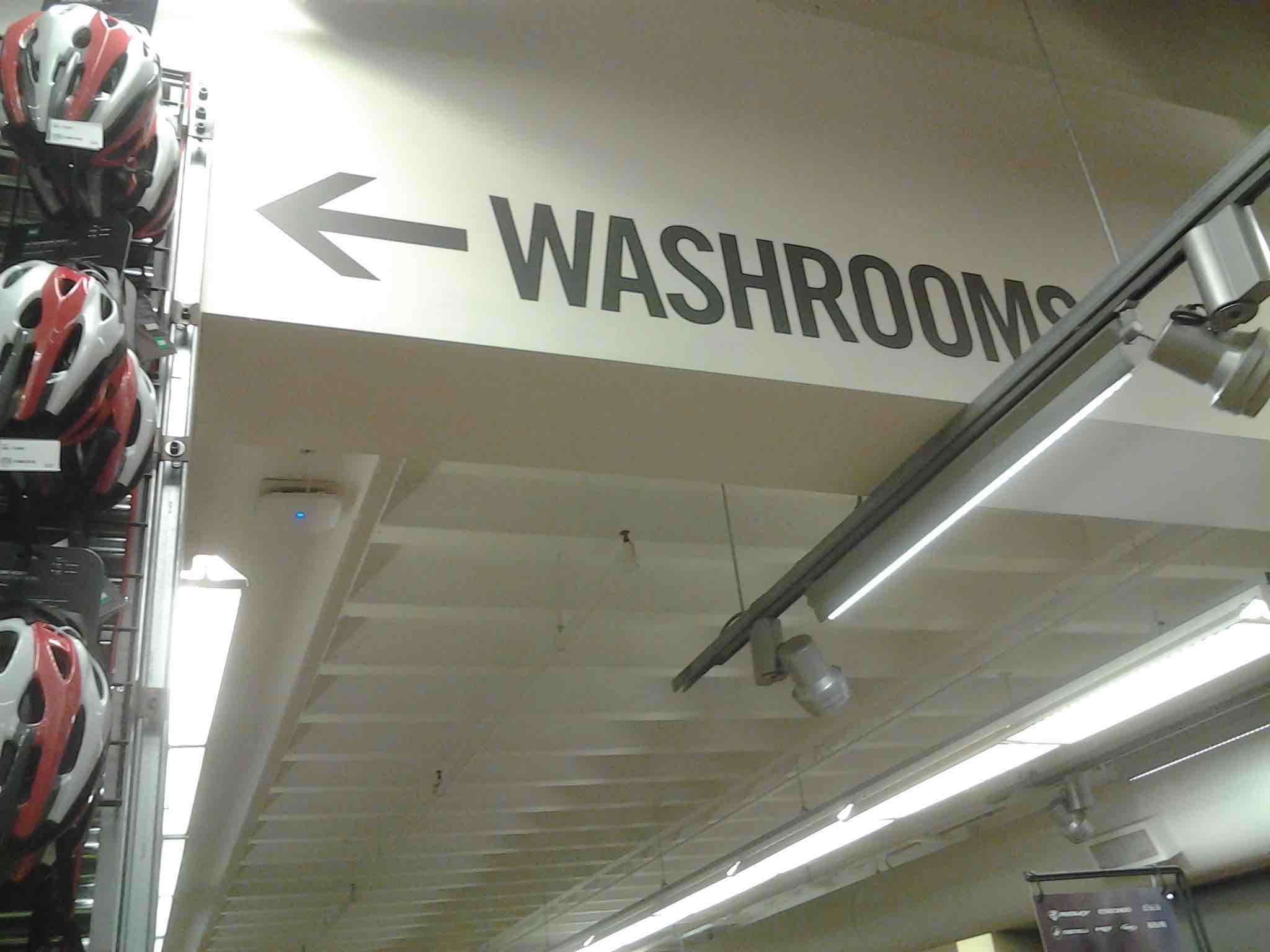 Image 1: Sign for <i>washrooms</i>, Mountain Equipment Coop, Vancouver. Photo: S. Dollinger