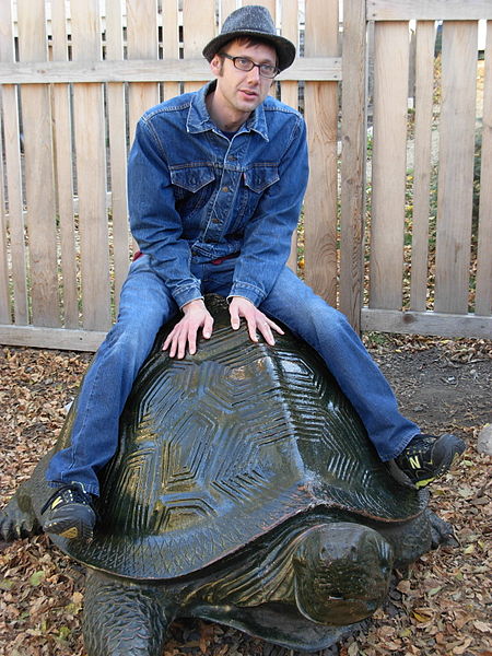 Image 1: <i>Canadian tuxedo</i> wearer on stone turtle (Source: Wikimedia Commons. Photo: rococohobo)