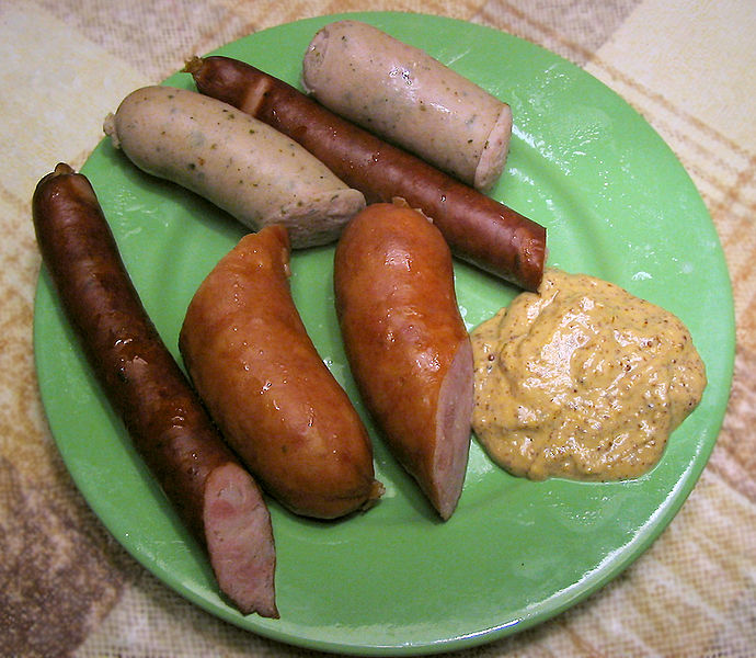 
        
        Image 1: Various <i>kielbasas</i>, the thick brown ones being the typical <i>kielbasas</i> or <i>kubasas</i>. Source: Wikimedia Commons. Photo: Hohum