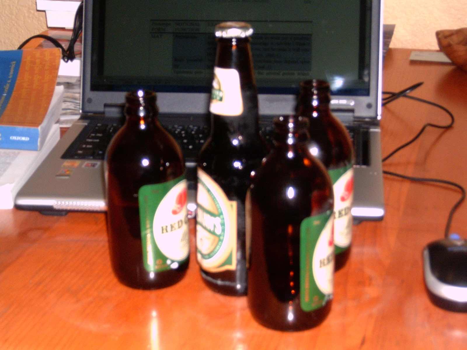 
        
        Image 1: Three <i>stubbies</i> and a regular Canadian beer bottle, which is modelled after the American long-neck bottle. Photo: S. Dollinger            