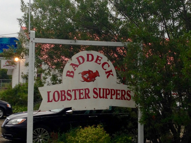 Image 2: A sign for a restaurant serving <i>lobster suppers</i> in Baddeck, NS. Photo: B. Ford