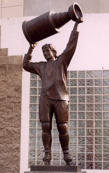 Image 1: Statue of <i>The Great One</i> hoisting the Stanley Cup in Edmonton, by John Weaver. Source: Wikimedia Commons. Photo: Aude 