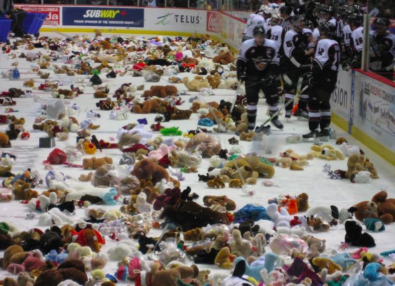 
        
        Image 1: A <i>Teddy Bear Toss</i> after the home team's first goal at a Vancouver Giants game, 15 Dec. 2006.  Source: Wikimedia Commons. Photo: iwona_kellie            