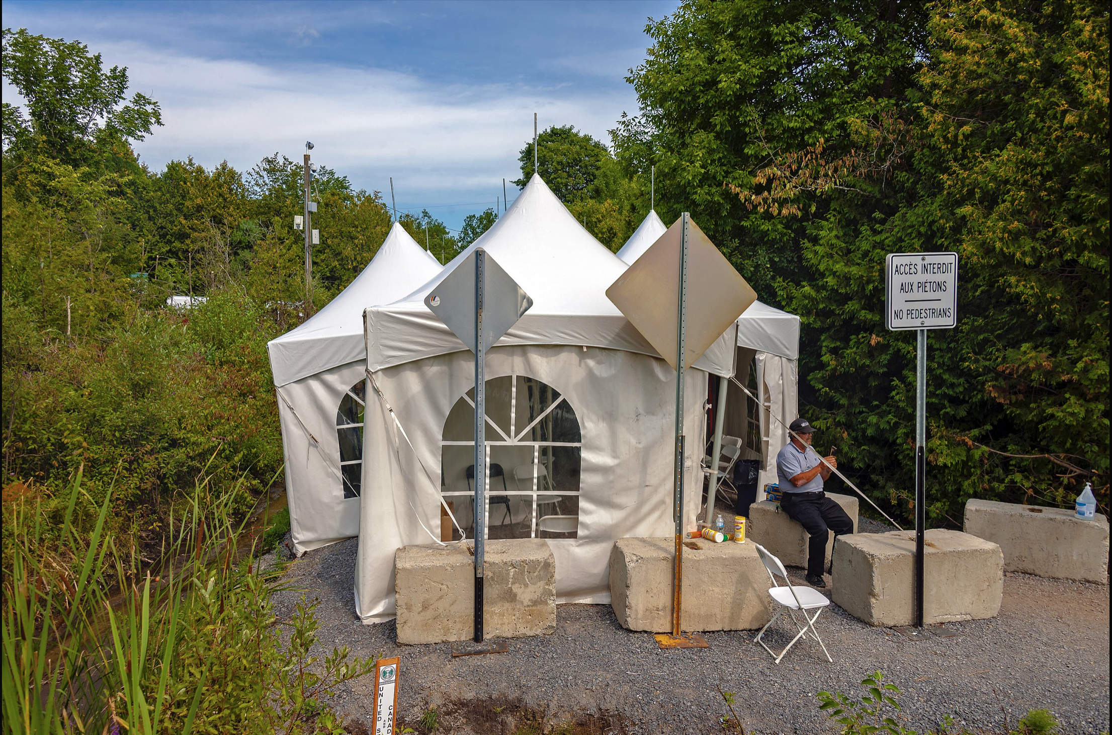 Image 2: Tents set up to process asylum seekers crossing the Canada-US border at <I>Roxham Road</I> in Aug. 2017. Photo: D. Case.