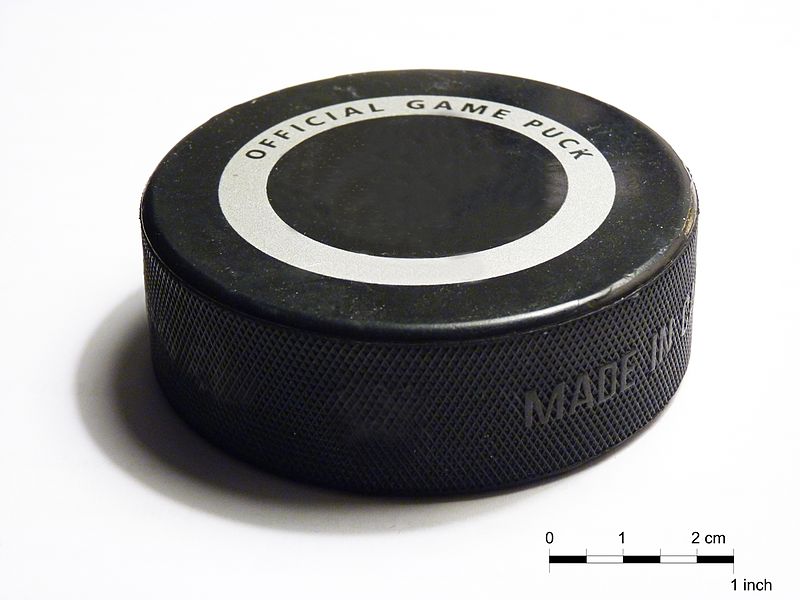 
        
        Image 1: A present-day hockey <i>puck</i>. Source: Wikimedia Commons. Photo: MrPanyGoff           